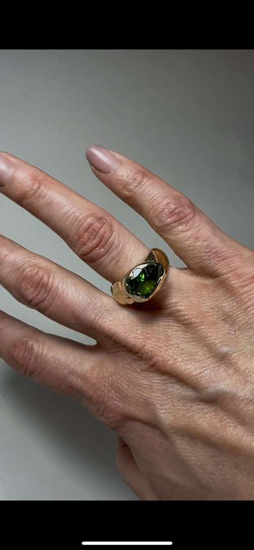 Gold pleated yellow brass ring with green CZ stone